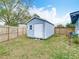 Backyard shed provides extra storage space, surrounded by a green lawn at 420 Sunrise Dr, Orlando, FL 32803