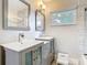 Updated bathroom with double vanity and stylish tile walls provides functional elegance at 420 Sunrise Dr, Orlando, FL 32803
