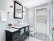 Bathroom featuring mosaic tile floor, modern vanity, and glass enclosed shower at 420 Sunrise Dr, Orlando, FL 32803