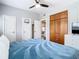 Comfortable bedroom features a ceiling fan and a wooden closet at 420 Sunrise Dr, Orlando, FL 32803