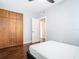 Modern bedroom with wood flooring, built-in wardrobe, neutral walls, and contemporary design at 420 Sunrise Dr, Orlando, FL 32803