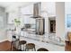 Open kitchen with granite island, stainless appliances, and breakfast bar at 420 Sunrise Dr, Orlando, FL 32803