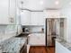 Well-lit kitchen features stainless steel appliances and granite counters at 420 Sunrise Dr, Orlando, FL 32803