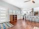 Inviting living space showcasing an open layout with hardwood floors and stainless steel appliances at 420 Sunrise Dr, Orlando, FL 32803