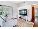 Comfortable living room with sliding door to sun room and paneled wall at 420 Sunrise Dr, Orlando, FL 32803