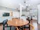Open living space featuring a dining area and kitchen with dark hardwood flooring at 420 Sunrise Dr, Orlando, FL 32803