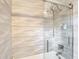 Modern shower features textured white tile and a glass enclosure for a spa-like experience at 420 Sunrise Dr, Orlando, FL 32803