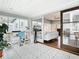 Bright sun room with patterned tile flooring and sliding glass door to living area at 420 Sunrise Dr, Orlando, FL 32803