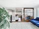 Bright sun room with patterned tile flooring and sliding glass door to living area at 420 Sunrise Dr, Orlando, FL 32803