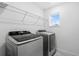 Bright laundry room with modern washer and dryer at 4917 Olivia Ct, St Cloud, FL 34772