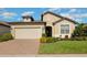 Charming single-Gathering home with a well-manicured front yard and two car garage at 605 Cantabria Dr, Davenport, FL 33837