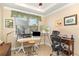 Bright home office featuring a drafting table, comfortable chair, and ample natural light at 605 Cantabria Dr, Davenport, FL 33837