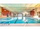 Indoor pool with 4-foot 6-inch depth and beautiful interior design at 605 Cantabria Dr, Davenport, FL 33837