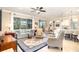 Bright and airy living room open to dining and kitchen, perfect for entertaining at 605 Cantabria Dr, Davenport, FL 33837