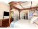 This main bedroom has a decorative wood four poster bed with ensuite bathroom and walk-in closet at 605 Cantabria Dr, Davenport, FL 33837