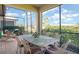 Inviting screened patio with outdoor dining table and views of the landscaped backyard at 605 Cantabria Dr, Davenport, FL 33837