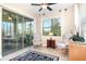 Sun room offering plenty of natural light with access to a screened-in lanai at 605 Cantabria Dr, Davenport, FL 33837