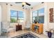 Cozy sun room with comfortable seating, bar cart, and lots of natural light at 605 Cantabria Dr, Davenport, FL 33837