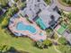 Community pool with surrounding lounge chairs and a putting green at 801 New Providence # B19/U801, Davenport, FL 33897
