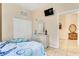 Bedroom with twin-size bed, dresser and access to a shared bathroom at 801 New Providence # B19/U801, Davenport, FL 33897