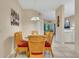 Bright dining room with wicker chairs and glass-top table at 801 New Providence # B19/U801, Davenport, FL 33897
