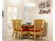 Bright dining room with wicker chairs and a glass table at 801 New Providence # B19/U801, Davenport, FL 33897