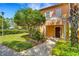 Inviting exterior of a two-story home with landscaping and walkway at 801 New Providence # B19/U801, Davenport, FL 33897