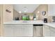 Kitchen boasts white cabinets, stainless steel appliances and tile backsplash at 801 New Providence # B19/U801, Davenport, FL 33897