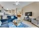 Relaxing living room with sectional sofa and a view of dining area at 801 New Providence # B19/U801, Davenport, FL 33897