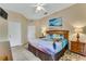 King-size bed, dresser, and calming ocean-themed decor in spacious bedroom at 801 New Providence # B19/U801, Davenport, FL 33897