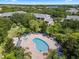 Resort-style pool with surrounding lounge chairs and landscaping at 801 New Providence # B19/U801, Davenport, FL 33897
