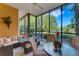 Spacious screened patio overlooking a lake with seating for dining and relaxing at 801 New Providence # B19/U801, Davenport, FL 33897