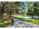 Scenic walkway along the lake with benches and landscaping at 801 New Providence # B19/U801, Davenport, FL 33897