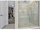 Large walk-in shower with bench seat and adjacent closet at 8024 Leaf Grove Cir, Orlando, FL 32836