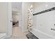 Bathroom with shower/tub combo and Peanuts themed shower curtain at 8024 Leaf Grove Cir, Orlando, FL 32836