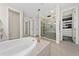 Spa-like bathroom with soaking tub, walk-in shower, and large closet at 8024 Leaf Grove Cir, Orlando, FL 32836