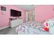 bedroom with Hello Kitty decor and a large TV at 8024 Leaf Grove Cir, Orlando, FL 32836