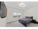 Bright bedroom with double windows, TV and modern decor at 8024 Leaf Grove Cir, Orlando, FL 32836