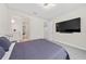 Comfortable bedroom with large TV and ample closet space at 8024 Leaf Grove Cir, Orlando, FL 32836