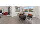 Elegant dining area with a modern table and four chairs, near sliding doors at 8024 Leaf Grove Cir, Orlando, FL 32836