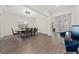 Spacious dining room with hardwood floors and modern furniture at 8024 Leaf Grove Cir, Orlando, FL 32836