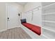 Built-in bench seating with storage in an entryway at 8024 Leaf Grove Cir, Orlando, FL 32836