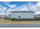 Rear view of two-story house with fenced backyard at 8024 Leaf Grove Cir, Orlando, FL 32836