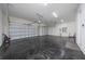 Two-car garage with epoxy flooring and electric car charger at 8024 Leaf Grove Cir, Orlando, FL 32836