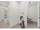 Bright hallway with wood-look floors, leading to home's interior at 8024 Leaf Grove Cir, Orlando, FL 32836