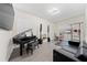 Home office or music room with piano, workout equipment, and seating at 8024 Leaf Grove Cir, Orlando, FL 32836