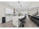 Modern kitchen with white cabinets and large island at 8024 Leaf Grove Cir, Orlando, FL 32836