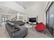 Spacious living room showcasing a sectional sofa and large TV at 8024 Leaf Grove Cir, Orlando, FL 32836