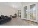 Spacious living room with hardwood floors and modern furniture at 8024 Leaf Grove Cir, Orlando, FL 32836
