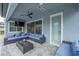 Covered patio with sectional sofa and TV at 8024 Leaf Grove Cir, Orlando, FL 32836